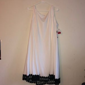 Sleeveless Ivory with black trim dress.